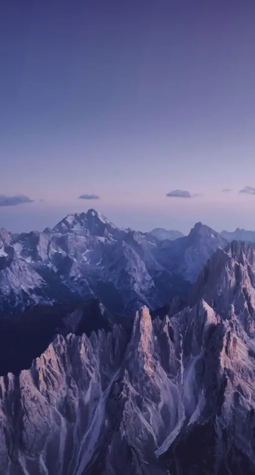 Yangwang brand motif: jagged alpine peaks at dusk